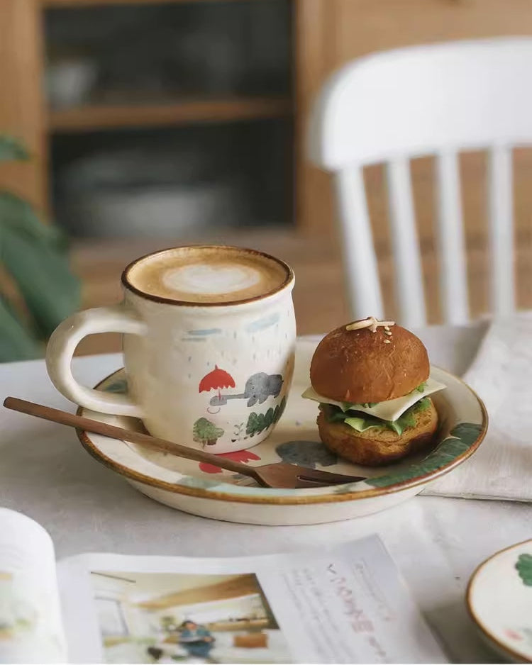 Cup of coffee with a pastry on a table in a cozy setting