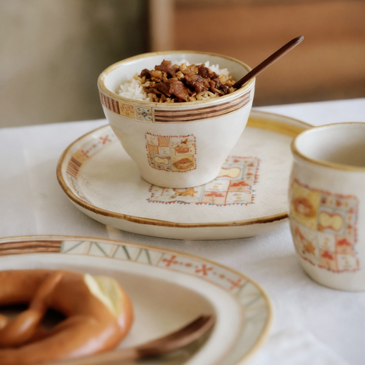 Ceramic bowl with food on a table with a blurred background